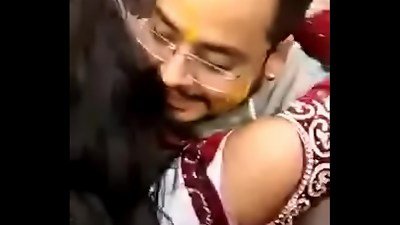 lovely Indian bride kissing publicly