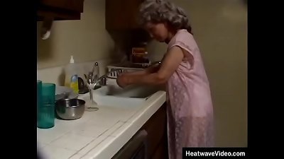 bawdy grandmother with grey-hair sucks off the ebony plumber